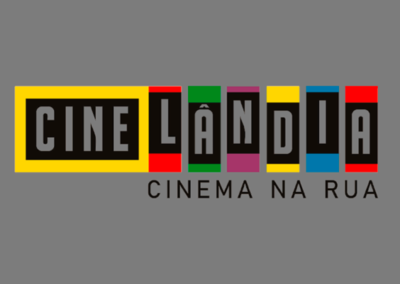 A imagem exibe a identidade visual do projeto Cinelândia – Cinema na Rua. O nome “Cinelândia” aparece em letras maiúsculas dentro de retângulos coloridos (amarelo, vermelho, verde, roxo, amarelo, azul e vermelho), com fundo preto para as letras. Abaixo, em letras pretas, está o subtítulo “Cinema na Rua”, sobre um fundo marrom claro.