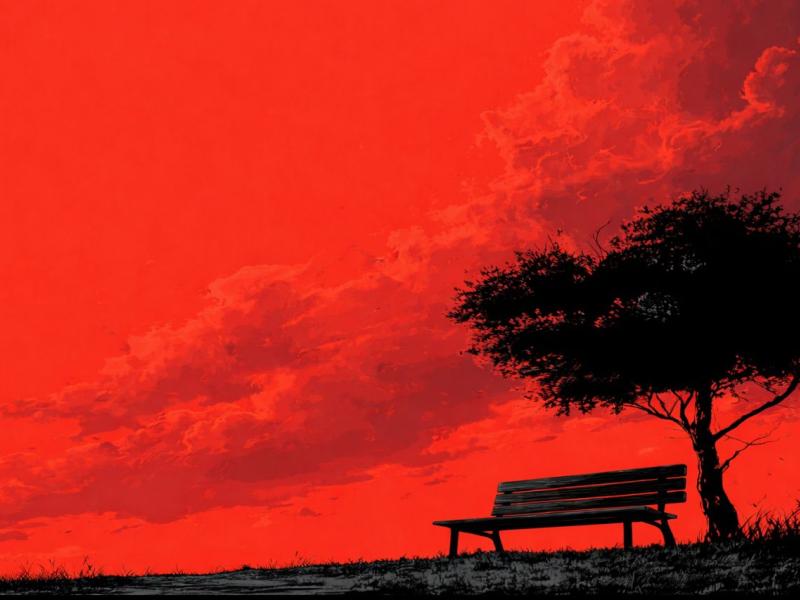 Imagem de forte contraste com predominância da cor vermelha no céu, sugerindo o fim de tarde. Em silhueta preta, vê-se uma árvore de copa ampla à direita e, sob ela, um banco vazio voltado para a paisagem. O chão escuro separa a terra do céu carregado de nuvens. A cena transmite quietude, contemplação e passagem do tempo, dialogando com a atmosfera evocada pelo título da peça Fim de Tarde.